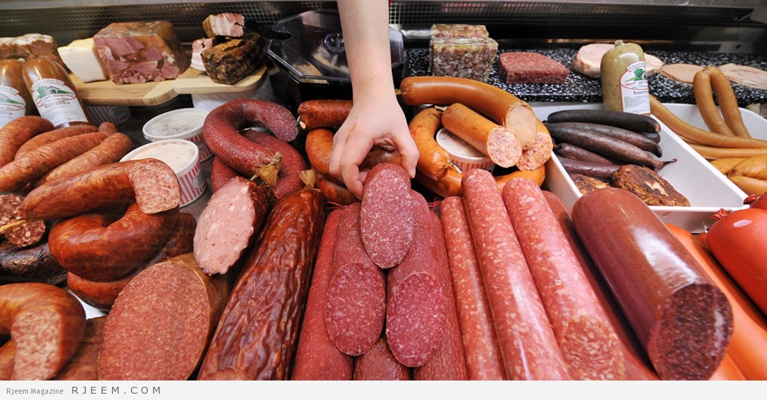 A saleswoman rearranges a display of German salami, among other meat products, at a meat shop in Berlin on January 13, 2009. German butchers now claim that salami was invented not in Italy, as is widely assumed, but in Germany. While the word "salami" originally comes from "salare", the Italian word for "to salt", the art of making salami was born not in Bologna, Italy, but Mecklenburg in north-eastern Germany, according to new research, published in a German newspaper on January 13. AFP PHOTO JOHN MACDOUGALL