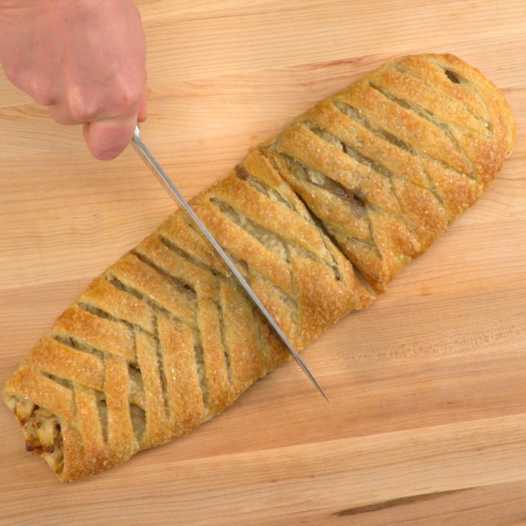 slicing-braided-apple-walnut-strudel